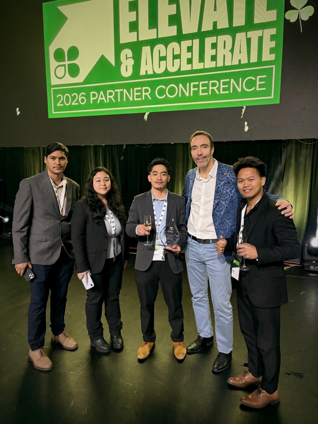 GT Legacy leaders with a Clover executive at the partner conference